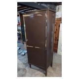 Two metal file cabinets and a metal wardrobe