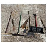Assortment of hand tools, including saws, brooms,