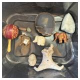 Small collectibles, including elephants, and rocks