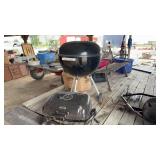 Two barbecue grills, including Webber cooker