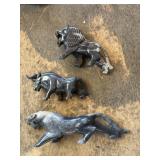 Marble sculptures of a bull, wolf & cougar