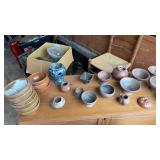 Several pieces of pottery. Some have chips on