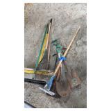 Large lot of garden tools, including shovels,