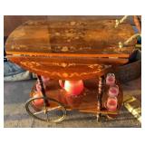 Decorative wood tea cart with water set.