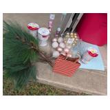 Red plastic bin of Christmas decor
