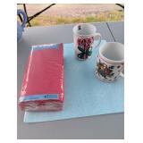 Red paper napkins (40) and two Christmas mugs