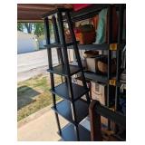 Black shelving unit that can be taken apart in 5