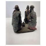 A Piece of Art with Four Men Sharing A Camp Fire 6x6x6 Inches Broken in Two Pieces