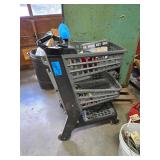 Black Plastic Shopping Cart on Wheels With Contents Including New in Box Hook Key Box, Grinding Wheel, Screwdrivers