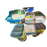 Contents of Bottom 2 Shelves - Several Bags of Pelletized Limestone Neutralizer - Bags of Fertilizer - Lime - Other Product