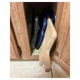 kitchen cabinet with cutting boards and flat trays/ french press coffee and coffee bean grinder