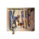 Contents On Pegboard Includes Wiperblades - Coping Saw - Caulking Gun