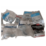 Assortment of Various Clamps and Brackets New in Package