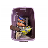 Tote of, Liquid Nails, Ceramic Fixture Caulk, Caulk Gun, Vintage Level, Cement Trowel, Work Light, Hand Plane, Drop Cloth, Coveralls.