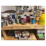 An Assortment of Various Sized Cans of Paint