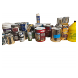 An Assortment of Various Sized Cans of Paint