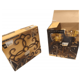 A Set of Sam Miguel Wall Sconces with a Set of Pillar Holders