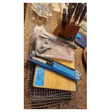 Various Knives and Knife Block.