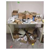 Contents on Table - Various Hardware - Batteries - Flags - Paint - Tools and More