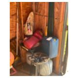 Contents in Corner of Shed 2 Gas Cans , 2 Propane Bottles Base for Outdoors Fryer
