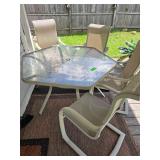 Outdoor Dining Set - Table 55" Across - 4 Chairs to Match. Very Nice Condition.