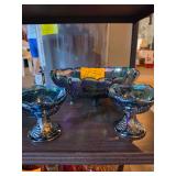 vintage Indiana Glass Harvest Grape iridescent blue carnival glass footed oval fruit bowl and matching small dishes.