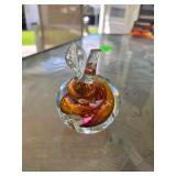 Handcrafted art glass apple paperweight with an amber and brown internal swirl, possibly made by Polish glass artist Marian Pyrcak.