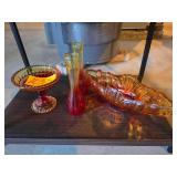 Amberina or iridescent carnival glass gondola / canoe bowl, often produced by mid-century makers like Jeannette Glass