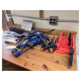 Contents on Table Including Irwin Quick Grips, Miter Box, Product