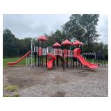 Outdoor Commercial Modular Playground Structure - Red Plastic Curved And Wave Slides - 4 Slides Total - Black And White Metal Framing - Climbing Arch -  Red Pitched Roof Caps - Monkey Bars - Stairs