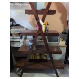 Dark Wood A-Frame Display Bookshelf w Crossing Support Legs, 2 Retevis Two-way Radios, VIZIO Wireless Subwoofer, Remainder of Contents on Shelf