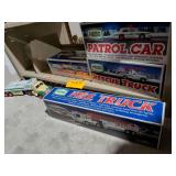 Collection of Hess Toy Trucks, Helicopter Truck, Fire Truck, Patrol Car, Rescue Truck and Emergency Truck Most in Boxes