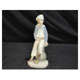 Lladró 4810 figurine, titled "Boy with Yacht"