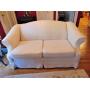 Off White Love Seat plus a White Slip Cover