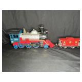 Battery-operated locomotive & Lionel Lines caboose