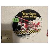 Round Coca Cola "Thirst Takes Wings" Sign