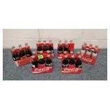 Several Coca-Cola Glass Bottles