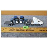 Semi w/ 2 New Holland Tractors on Trailer