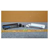 (2) New Holland Semis w/ Van Trailers