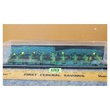 Assortment of John Deere 1/64 Tractors in Display
