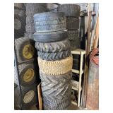 Stack approx 15 Lawn and garden tires w/shelf and