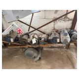 Eight Electric Motors Under Workbench