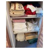 3 shelves of towels-3rd, 4th and 5th shelf of towe