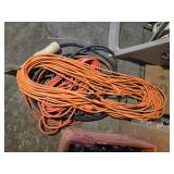 Pile of extension cords and hose reel