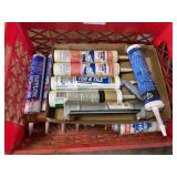 Tote of Misc. Caulking and Rust Oleum Paint