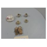 Miniature Porcelain Dolls and cups.