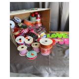 Assorted Crafting Ribbon Spools and Holiday Trimmi
