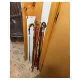Assorted Wooden Walking Canes and Gentleman
