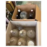 Assorted Clear and Amber Glass One Gallon Jugs and
