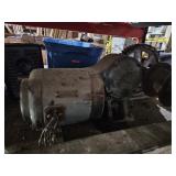 HEAVY STEEL MOTOR MOUNTED ON RAILS WITH A PULLEY